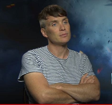 a man with his arms crossed standing in front of a blue and white background that says captain ...