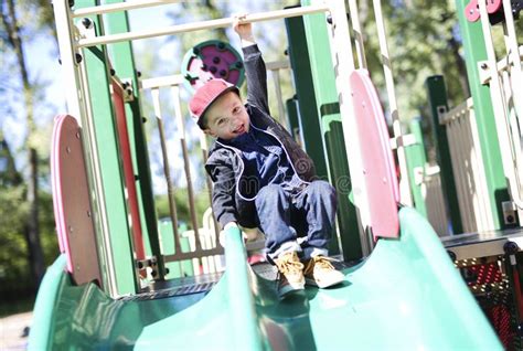 Happy Kid Having Fun Playing in Slider Stock Image - Image of active ...