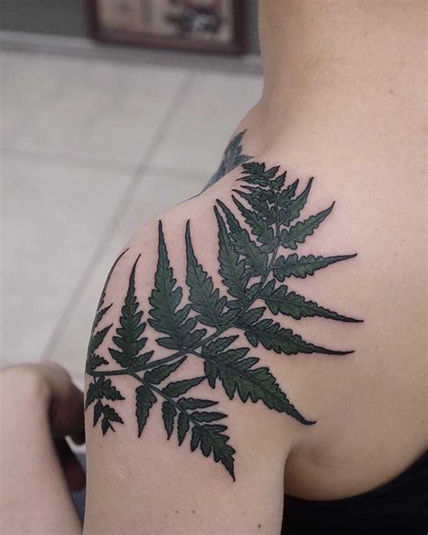 Fern leaf tattoo on the shoulder - Tattoogrid.net