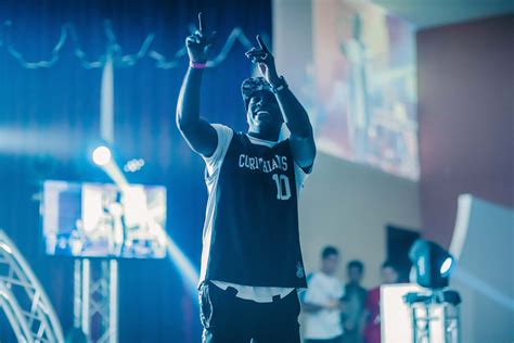 Man Wearing Basketball Jersey Standing On Stage · Free Stock Photo