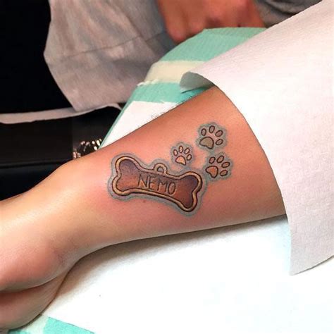 Dog Bone and Paws Tattoo Idea