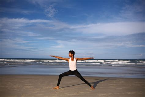 Man Doing Warrior Yoga Pose Outdoors