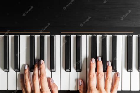 Free Photo | Closeup of hands playing piano music and hobby concept