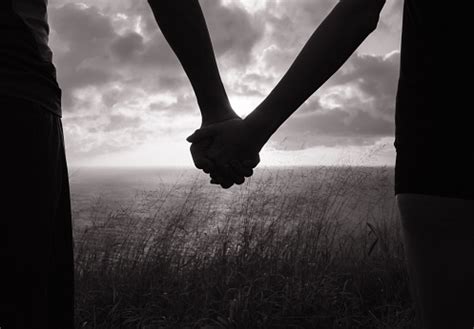 Black And White Image Of Couple Holding Hands In Silhouette Stock Photo - Download Image Now ...