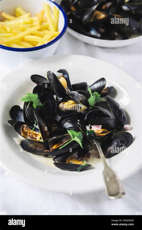 Mussels with french fries Stock Photo - Alamy