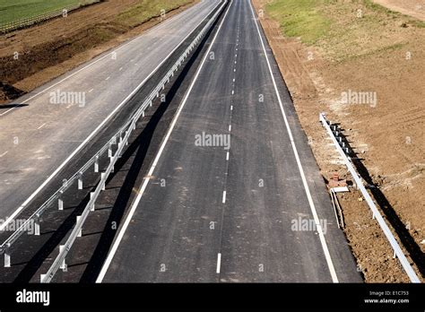 A deserted new dual carriageway road not yet in use as it is ...