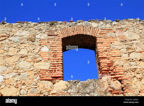 brick segmental arch in ancient masonry stone wall Spain Stock Photo, Royalty Free Image ...