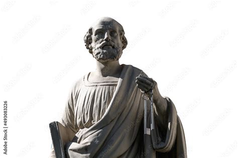 Antique statue of St. Peter with keys to the Kingdom of Heaven. Ancient statue isolated on white ...