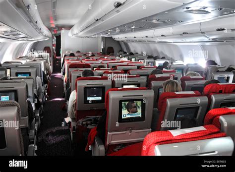 Travel by passenger plane interiors Virgin Atlantic Airbus jet Stock Photo - Alamy