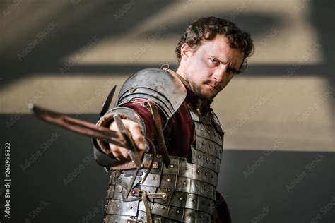 Medieval knight pointing sword to camera Stock Photo | Adobe Stock