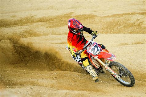 Person Riding Number 27 Motocross Dirt Bike · Free Stock Photo