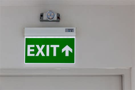 What are the laws behind exit signs & emergency lighting?