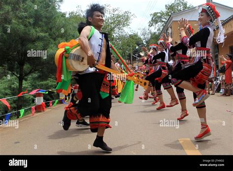 Mile, China's Yunnan Province. 9th Aug, 2017. People of Yi ethnic group perform folk dance ...