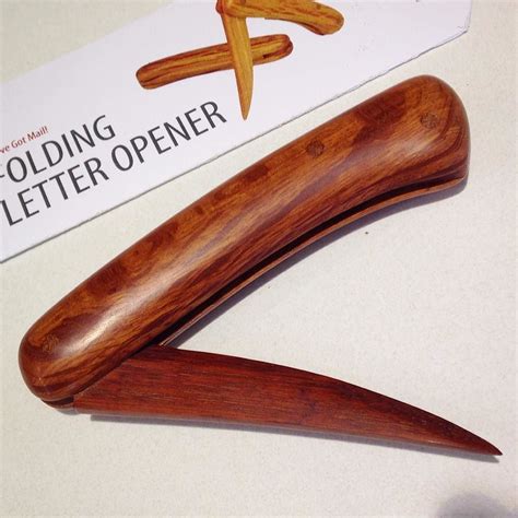 The folding letter opener has no metal and no springs - all wood https ...