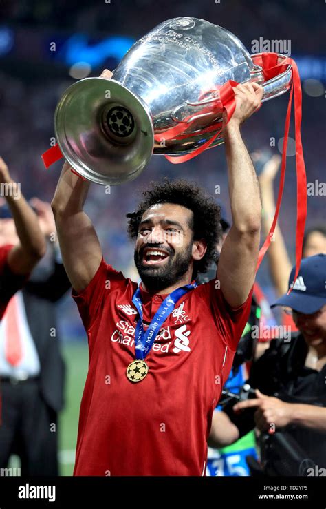 Liverpool's Mohamed Salah celebrates with the trophy after the UEFA ...