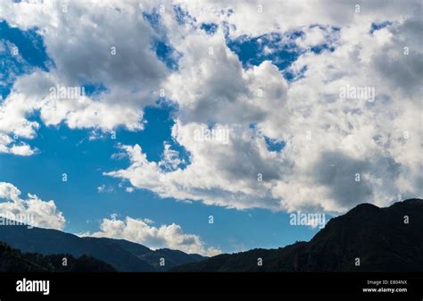 Cloudy mountain landscape Stock Photo - Alamy