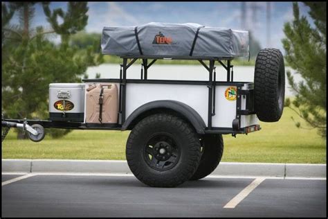 a white and black truck with a cover on it's back tire is parked in a ...