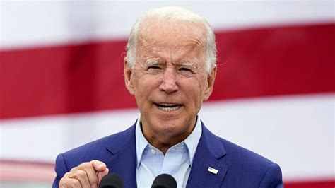 Blue Coat Wearing President Joe Biden With Red And White Background HD ...