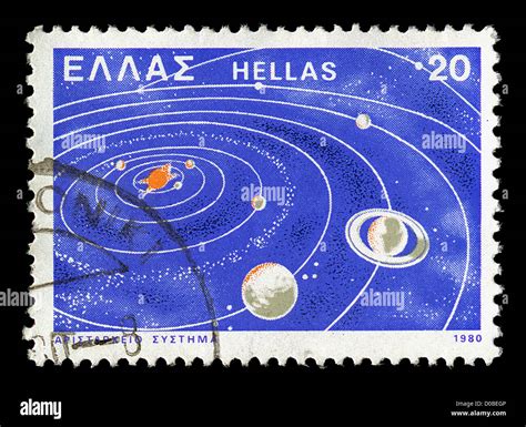 Vintage postage stamp with illustration of first heliocentric model of the solar system as ...