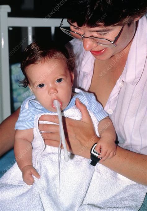 Baby vomiting - Stock Image - M831/0110 - Science Photo Library