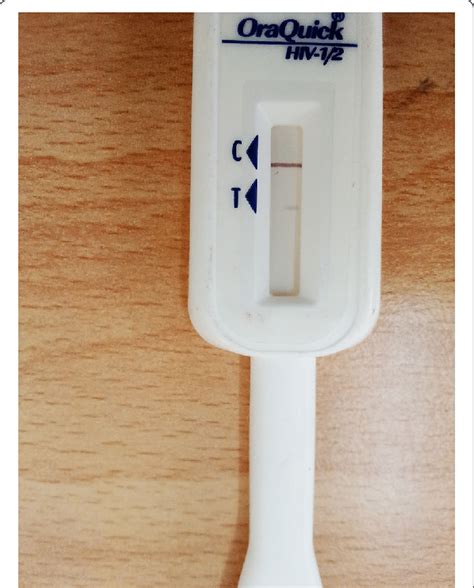 HIV self-kit that shows a faint second weak band in the 'T' area of the kit | Download ...