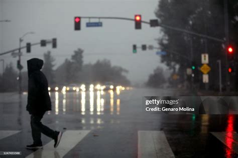 ENCINO, CA - FEBRUARY 24, 2023 - A pedestrian make his way through ...