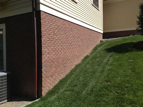 Thin brick veneer installed over concrete foundation. By PLASSE MASONRY ...