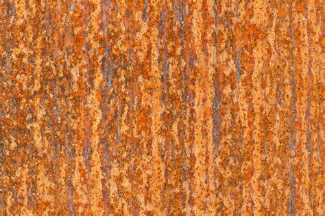 "Rust Patterns, Close Up" by Stocksy Contributor "Mark Windom" - Stocksy