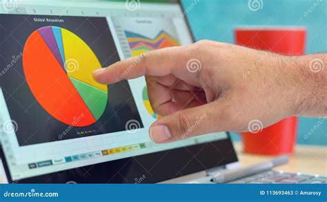 Businessman Pointing and Expanding Graphs on Modern Touch Screen Laptop ...