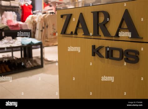 Zara kids shop inside a main Zara store in Barcelona, Spain Stock Photo ...