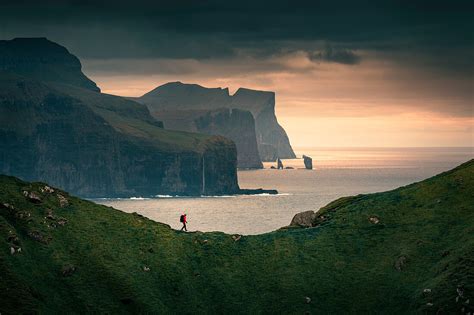 Man hiking on cliff on Kalsoy island, … – License image – 71360826 ...