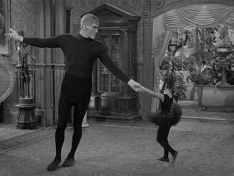 Wednesday ( Lisa Loring) teaching Lurch (Ted Cassidy) how to dance. | Addams family, Addams ...