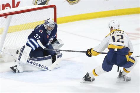 Connor Hellebuyck stops 28 shots, Jets beat Predators 2-0