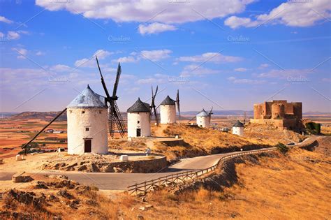 Windmills and castle of Consuegra. S | High-Quality Architecture Stock Photos ~ Creative Market