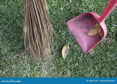 Sweeping Leaves Off The Yard With Walis Tingting And Dustpan. Walis Tingting Is A Philippine ...