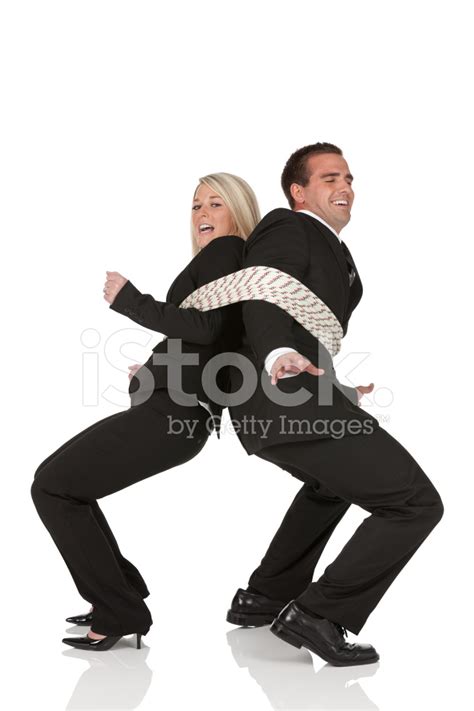 Business Couple Tied Up With A Rope Stock Photo | Royalty-Free | FreeImages