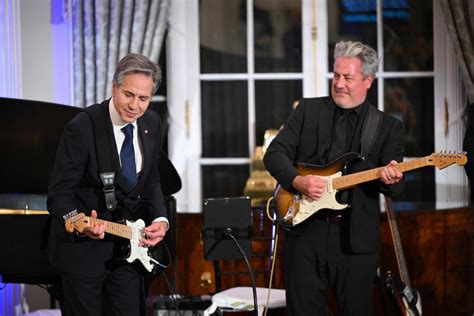 Antony Blinken sings and plays electric guitar on Muddy Waters cover at State Department event