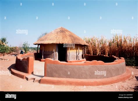 Traditional thatched rondavel with wall Stock Photo - Alamy