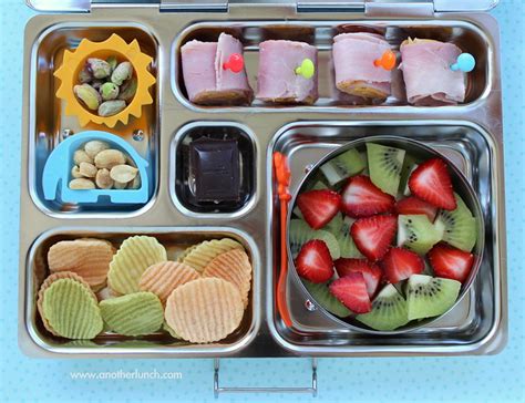 Kindergarten school lunch - ham & cheese rolls, nuts, veggie chips, strawberries and kiwi ...