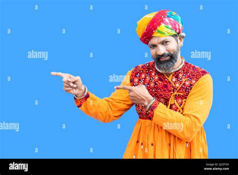 Happy beard Indian man wear traditional colorful outfit and turban ...