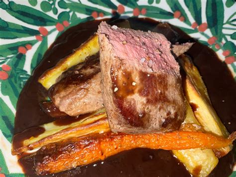 Venison Loin with a Red Wine and Juniper Sauce Served with Roasted Carrots and Parsnips