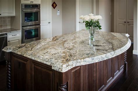 Granite kitchen island with a curved shape overhang and double stacked laminated edg… | Brown ...