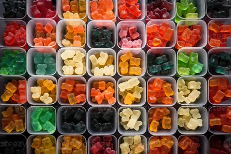 illustration of vast array of different gummy bear flavors in open ...