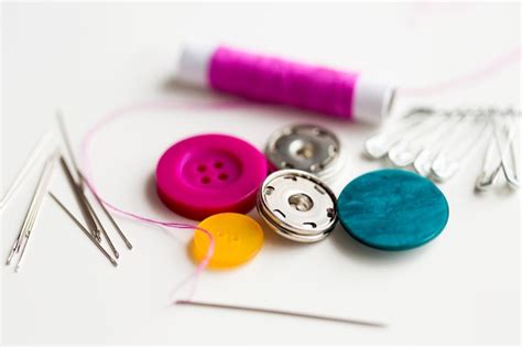 Premium Photo | Needlework and tailoring concept - sewing buttons ...