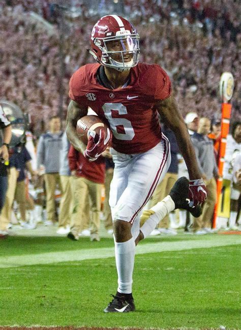 Alabama's DeVonta Smith smiles as he crosses the end zone for a toucown in the third quarter. HD ...