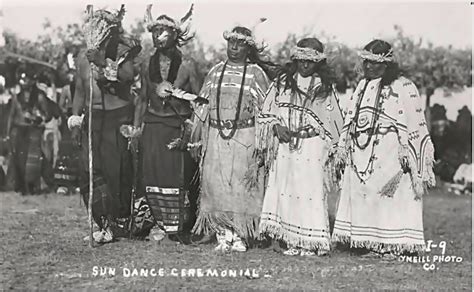 Five unidentified Sioux Indians, two men and three women, wear ceremonial sun dance cloth ...