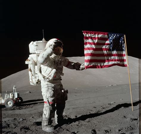 Neil Armstrong On The Moon Holding Flag