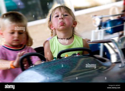 Kids on carnival ride Stock Photo - Alamy