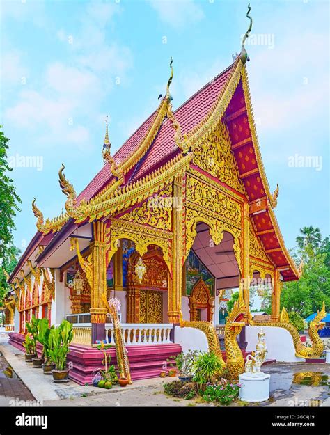 The splendid facade of Wat Sangkharam Temple with tall gable roof, fine ...