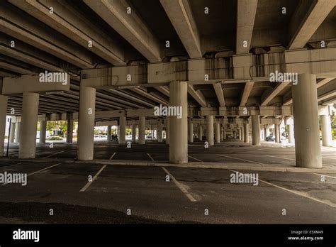 Parking lot under overpass Stock Photo - Alamy